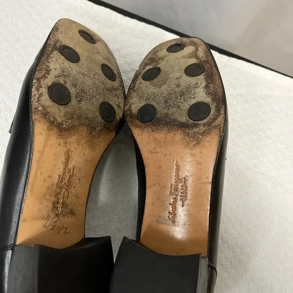 Salvatore Ferragamo Black Loafer Flats with silver logo hardware. Corpcore